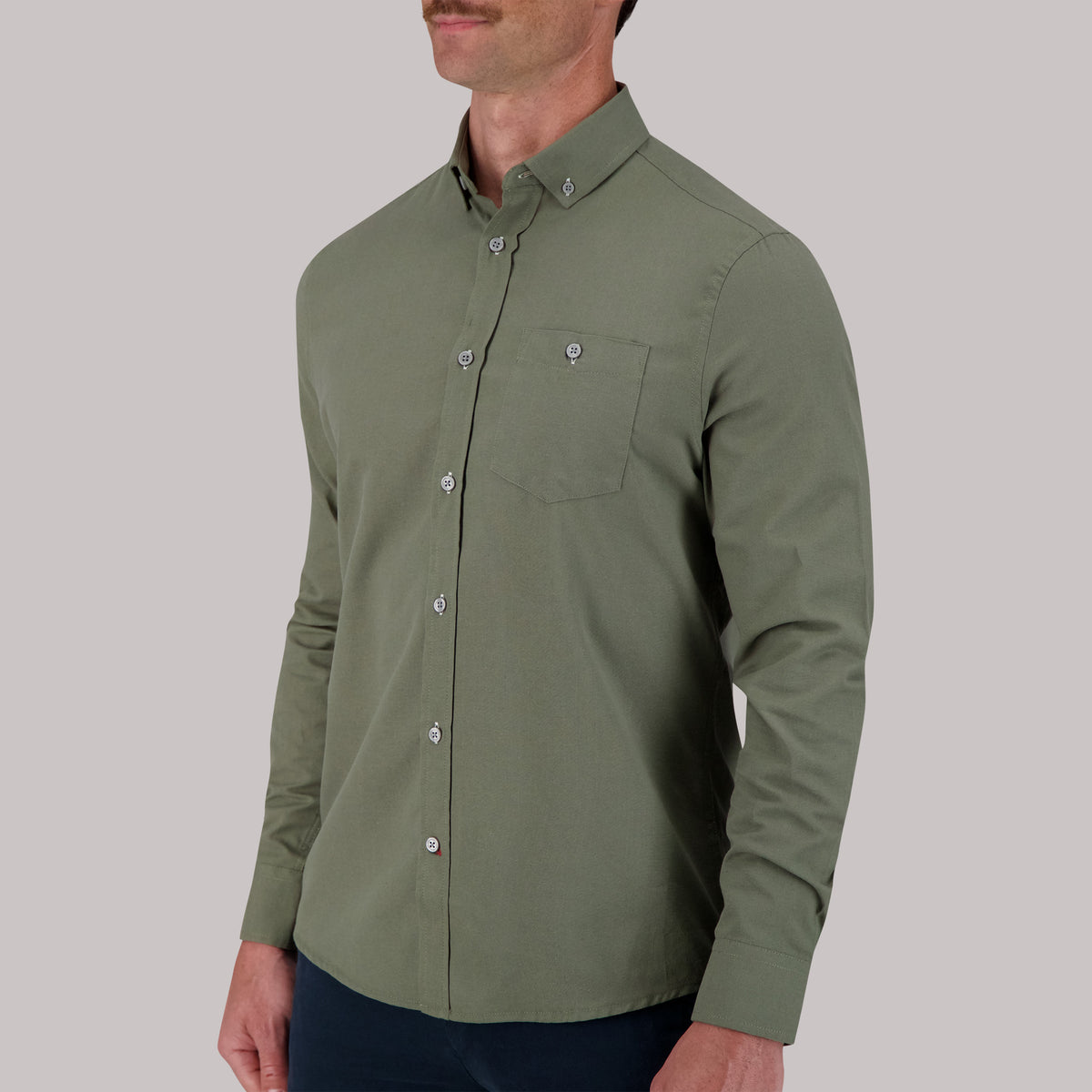 Model Side View of Long Sleeve Oxford Sport Shirt in Moss