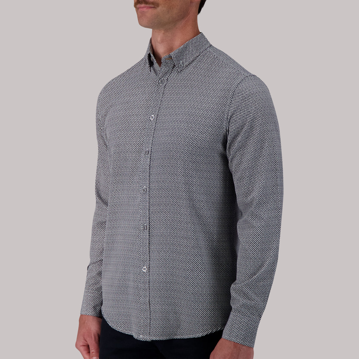 Model Side View of Long Sleeve 4-Way Sport Shirt with Geometric Print in White