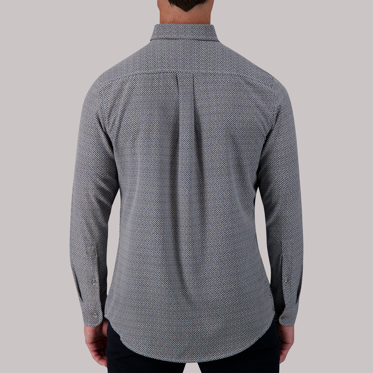 Model Back View of Long Sleeve 4-Way Sport Shirt with Geometric Print in White