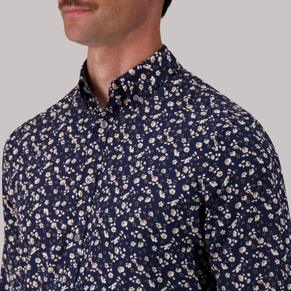 Model Front Up Close View of Long Sleeve 4-Way Sport Shirt with Floral Print in Navy