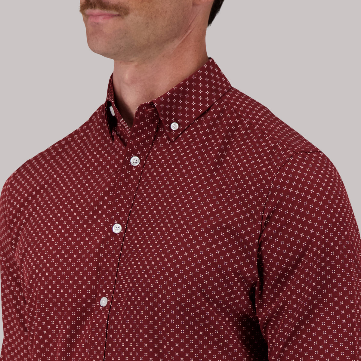 Model Front Close Up View of Long Sleeve 4-Way Sport Shirt with Geometric Print in Burgundy